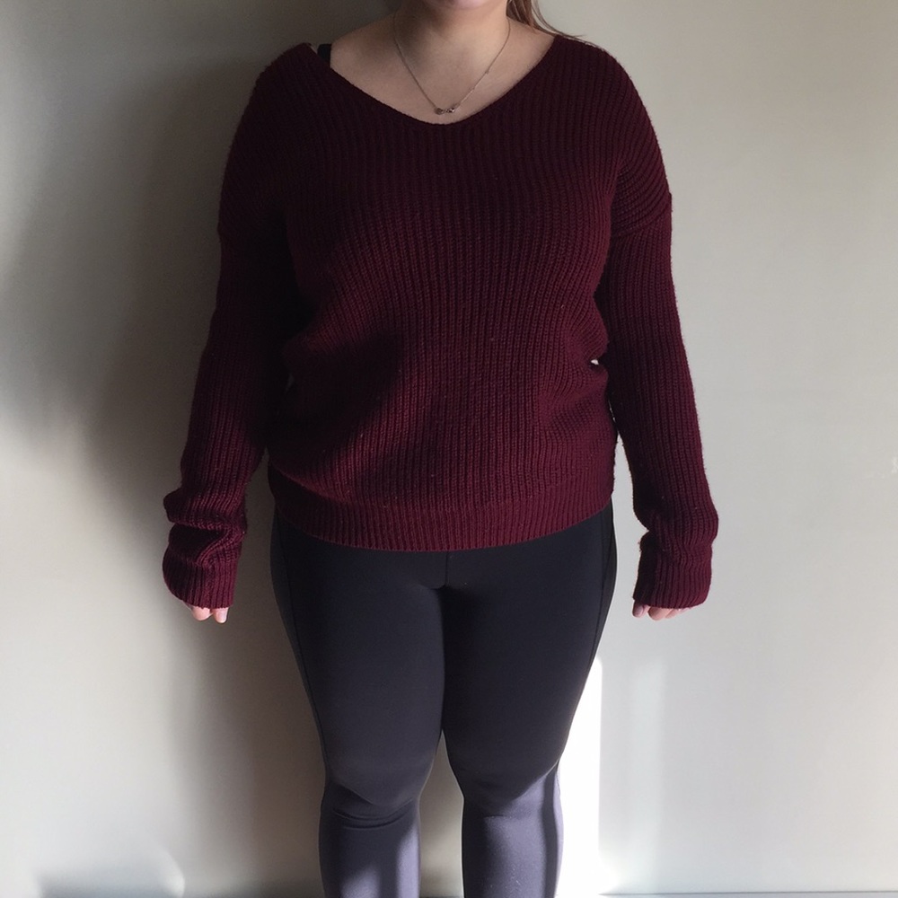 Knit sweater with crossed back
